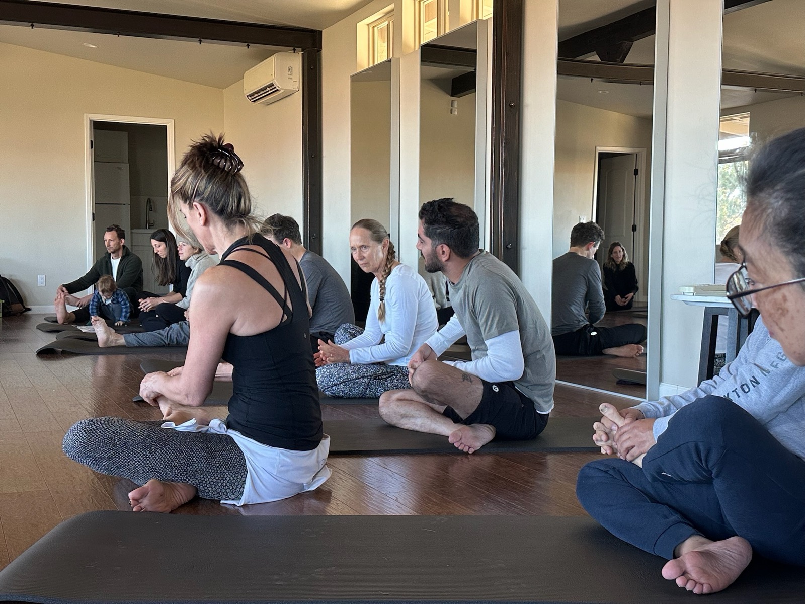 Workshop participants seated in a circle during a guided TRU Core Method session