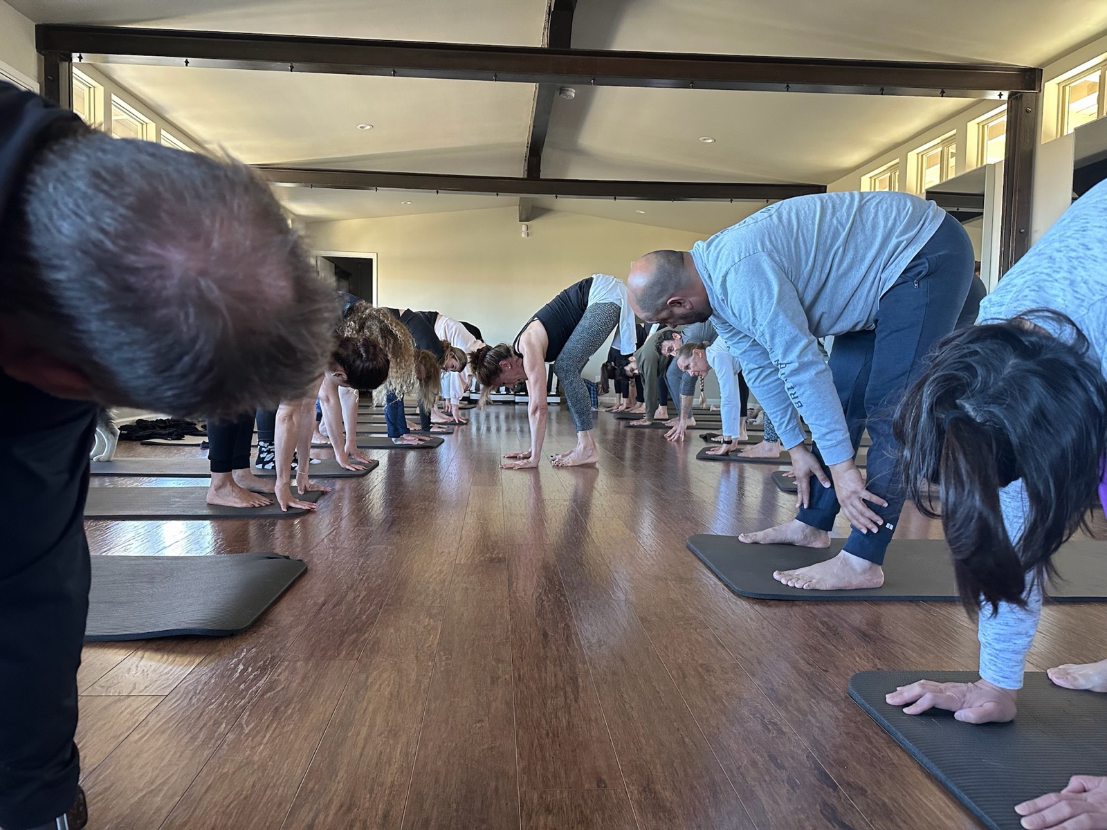 A workshop group moving through a guided floor sequence together